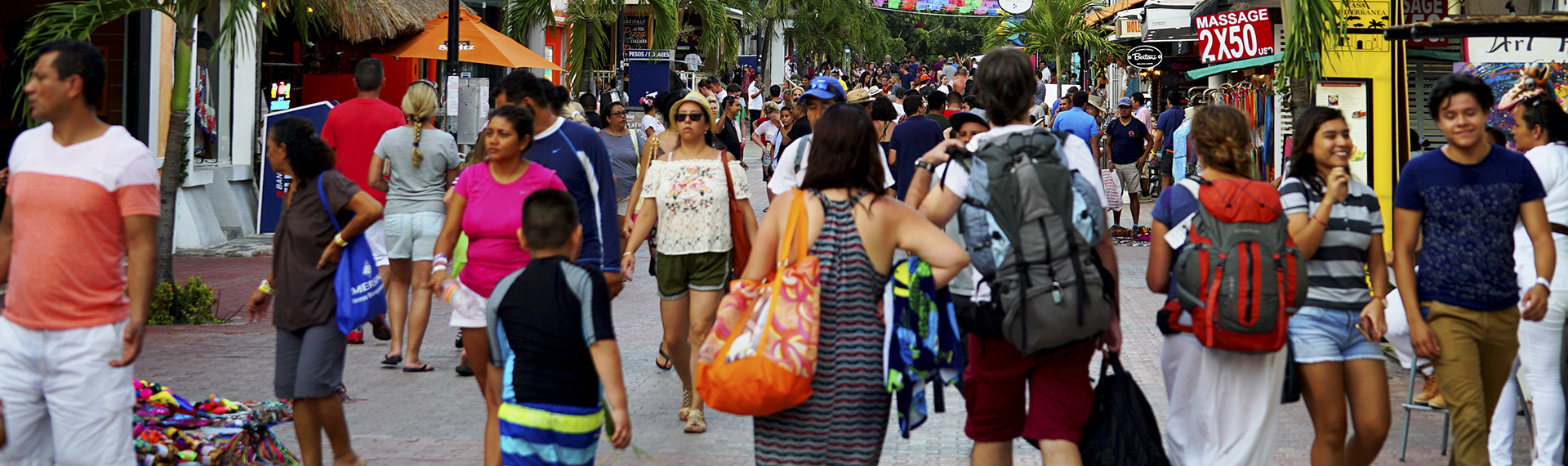 People on the 5th avenue of Playa del Carmen People touring the 5th avenue of Playa del Carmen