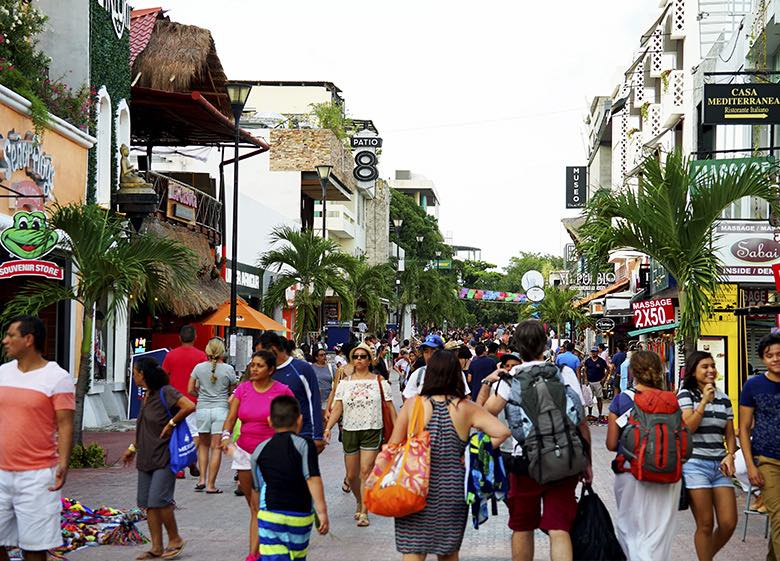 People touring the 5th avenue of Playa del Carmen